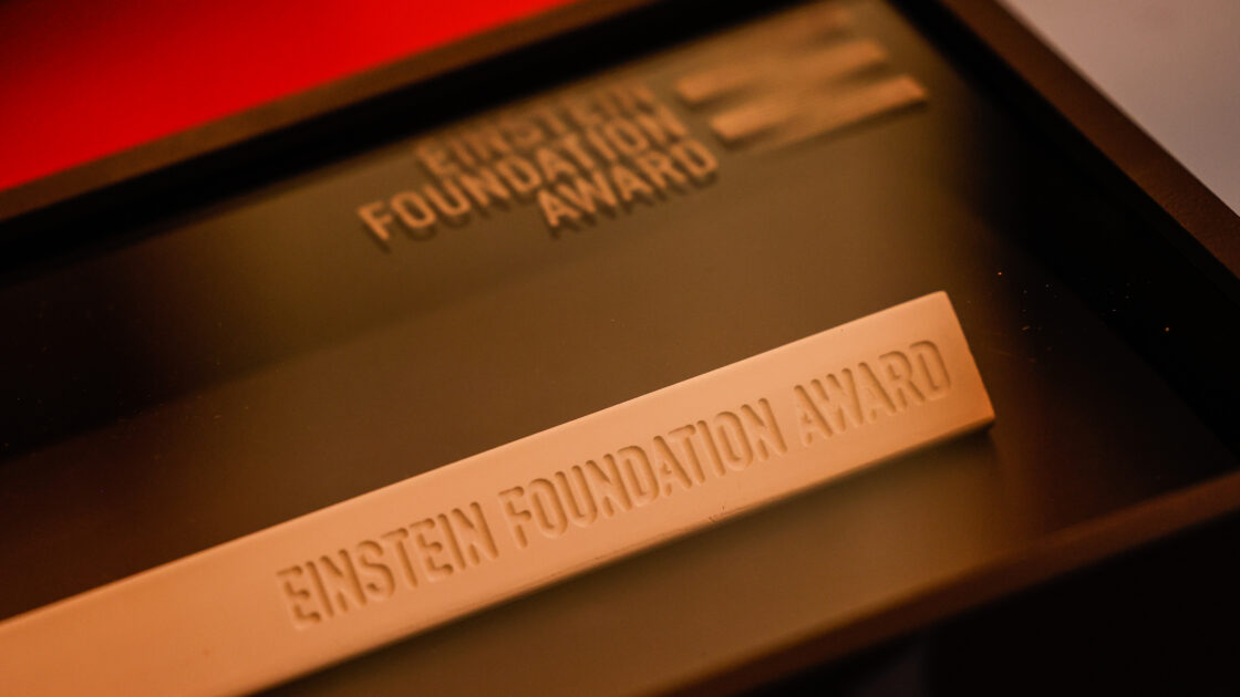 The Einstein Foundation Award elegantly presented in a display box.