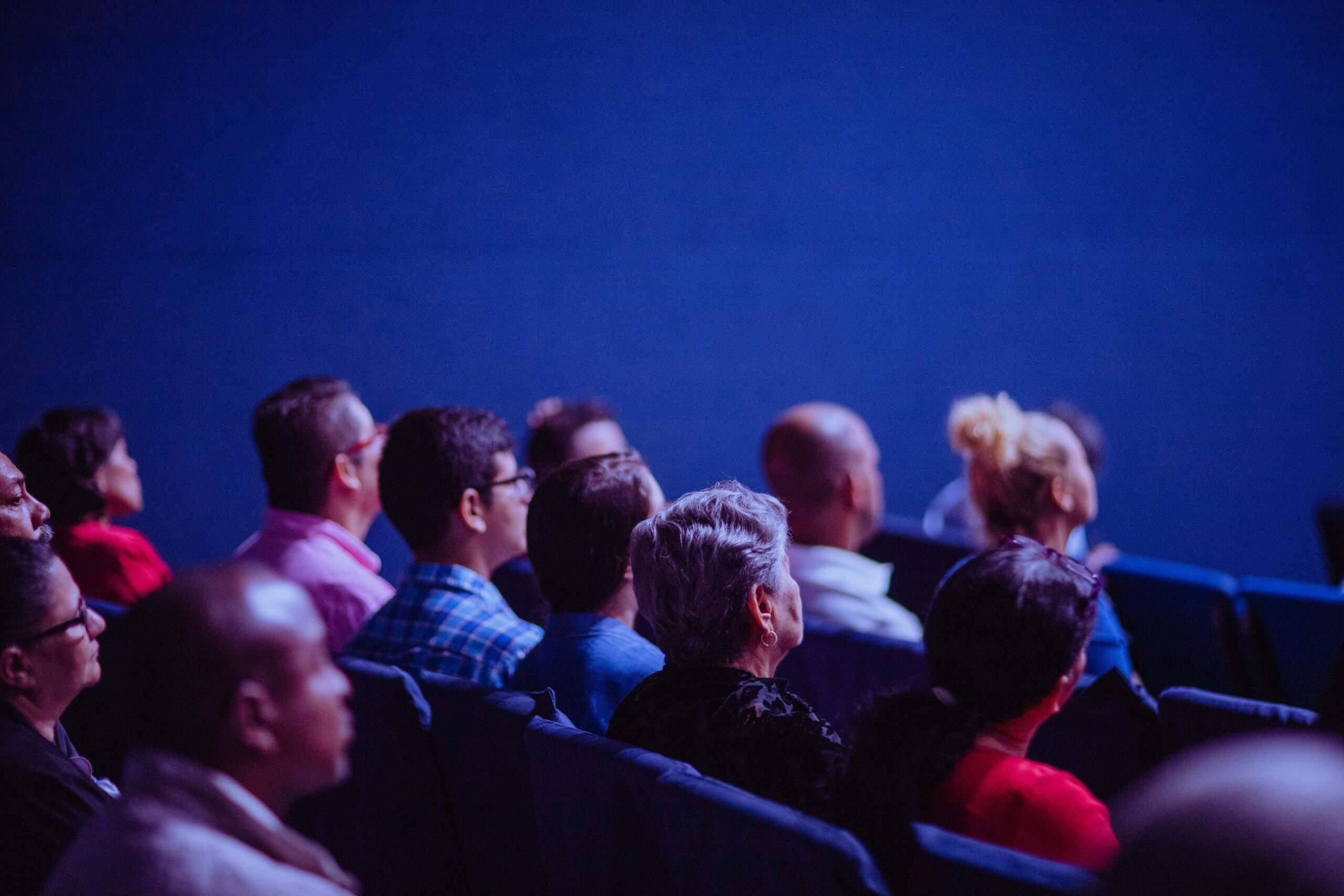 A diverse audience watching an event.